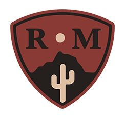 Desert scene with the moon between the letters "R" and "M"