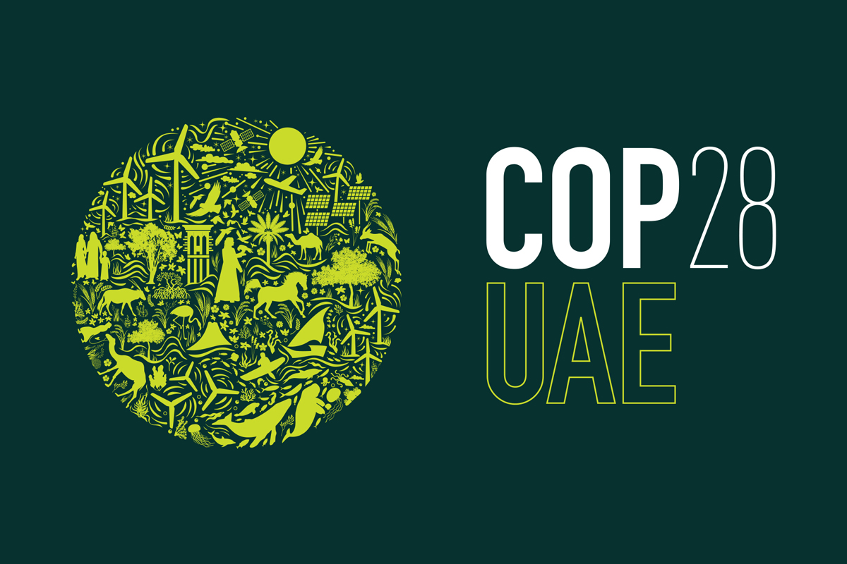 Graphic that features the text: CO28 UAE. A circle of artwork is featured that contain symbols of clean energy, technology, plants, animals, people.