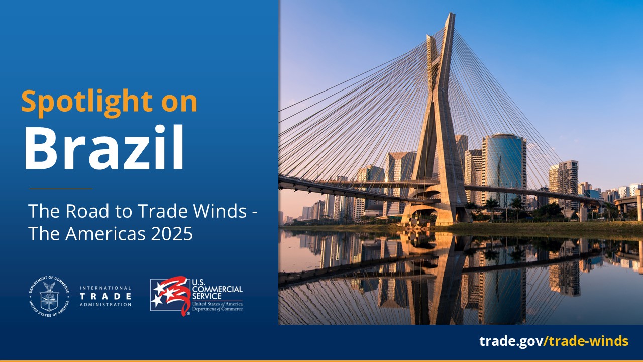 A graphic featuring an image of the Sao Paulo, Brazil skyline and a bridge. On the left hand side, there is text that reads, "Spotlight on Brazil, The Road to Trade Winds - The Americas 2025". The graphic also features the International Trade Administration and Commercial Service logos.