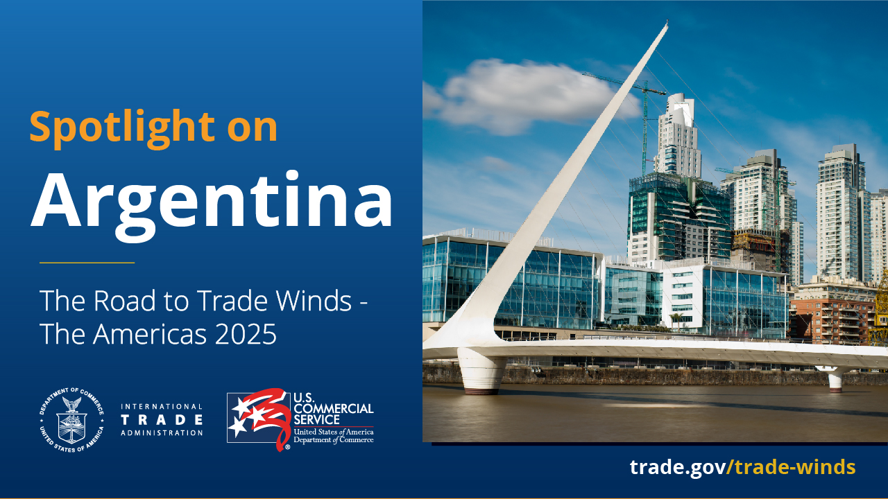 A graphic featuring an image of a bridge and an urban area with numerous skyscrapers in the background. On the left hand side, there is text that reads, "Spotlight on Argentina, The Road to Trade Winds - The Americas 2025". The graphic also features the International Trade Administration and Commercial Service logos.