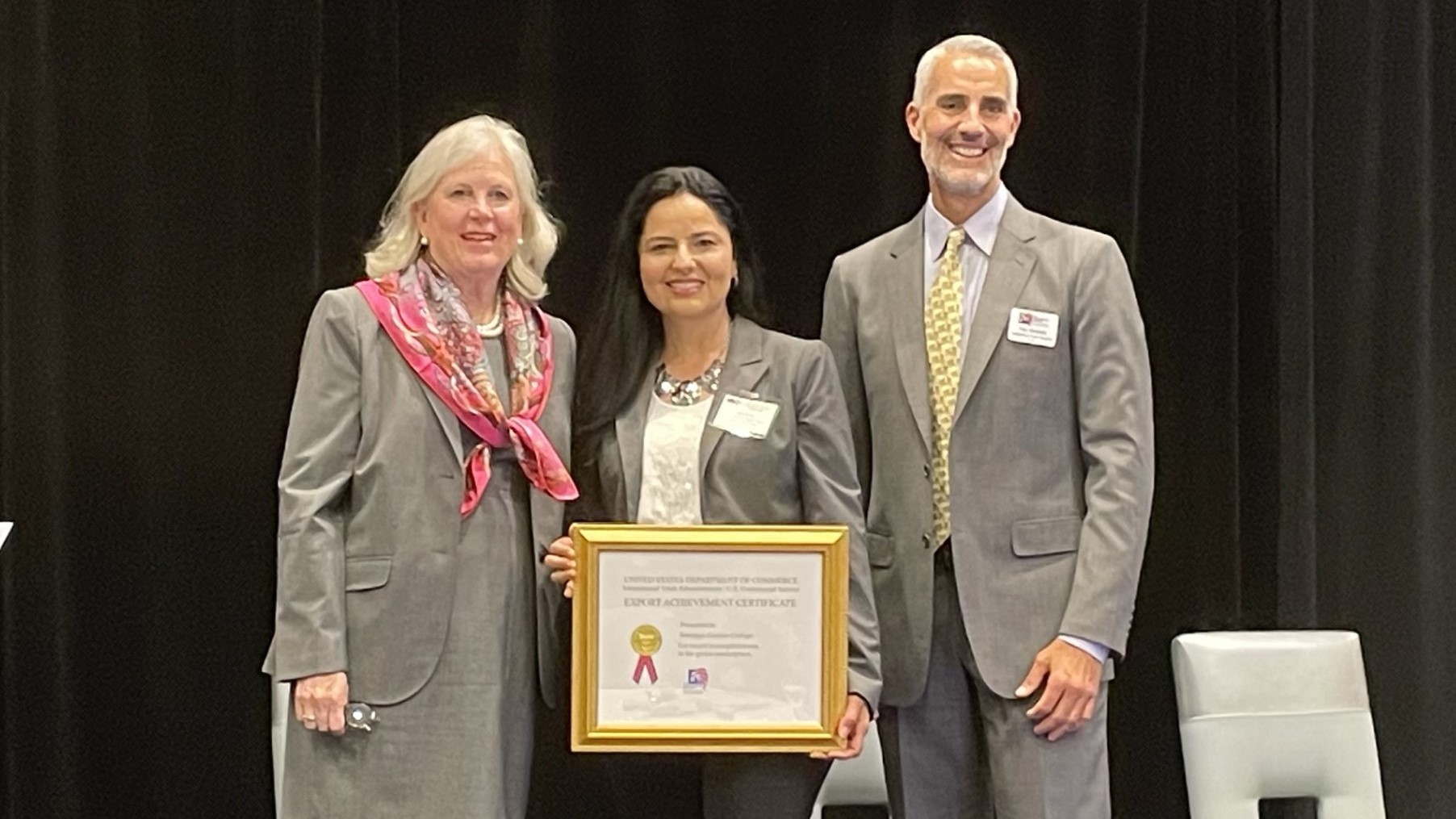 Santiago Canyon College staff receiving Export Achievement Certificate 