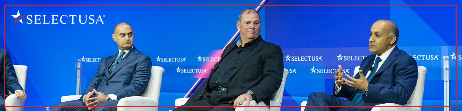 Panelists sit on a stage at the SelectUSA Investment Summit.