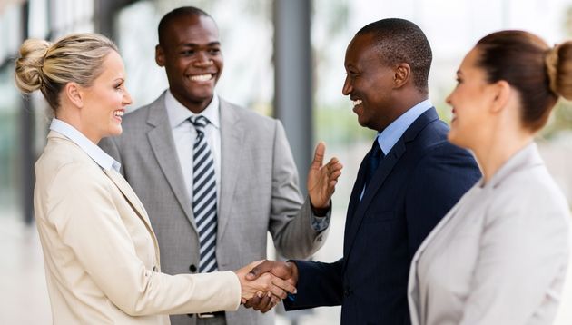 Business people shaking hands.