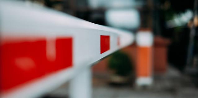 Red and white traffic barrier pole