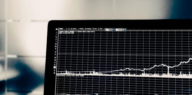 EC Card Laptop displaying data trend lines