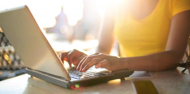 Woman typing on laptop