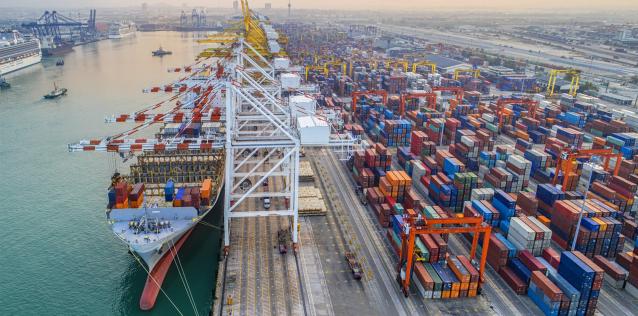 commercial vessel container ship alongside of berth in port congestion for loading and discharging containers services Image