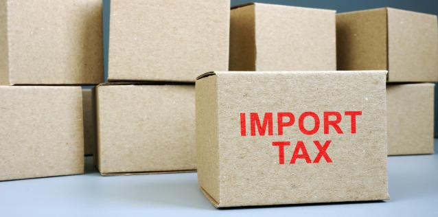 Brown box with red colored Import Tax label