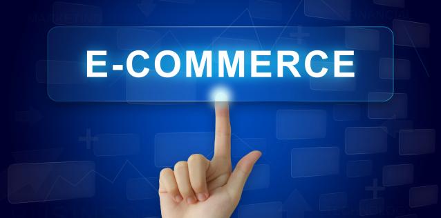 Finger pointing at button with words "e-commerce"