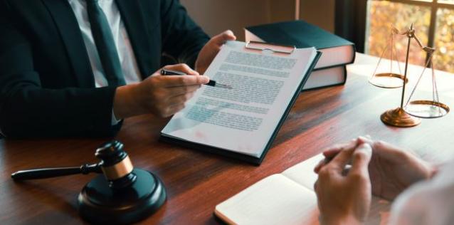 Man walking woman through export legal document