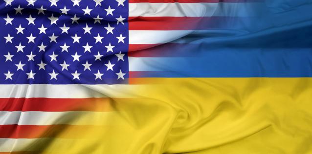 Image of U.S. flag fading into the Ukrainian flag