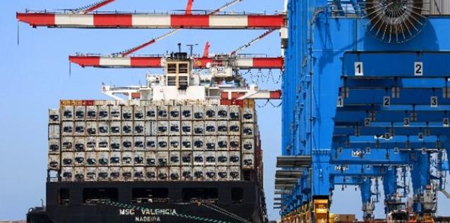 Cargo ship with refrigerated cargo containers at port