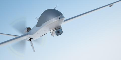 Image of a drone against blue sky