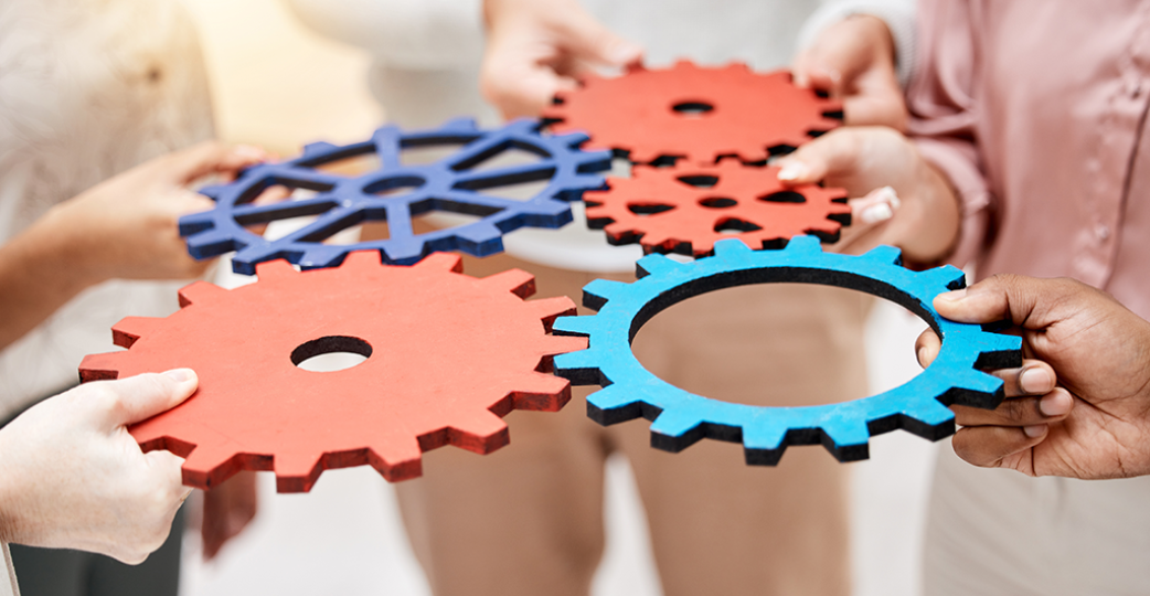 group and hands with gears