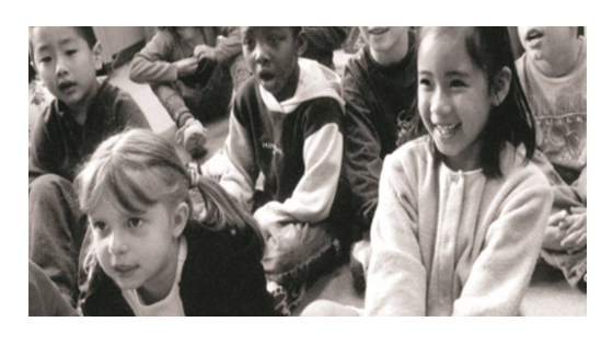 A group of seven students smiling